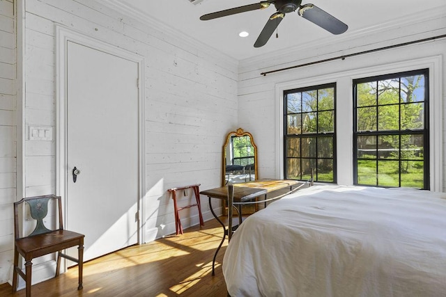 bedroom featuring hardwood / wood-style floors and ceiling fan