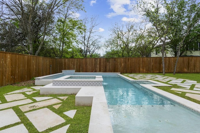 view of swimming pool featuring an in ground hot tub and a yard