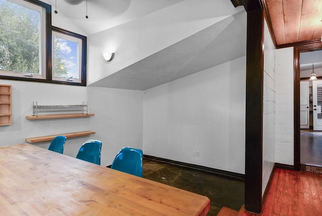 office featuring dark hardwood / wood-style flooring, wood ceiling, and lofted ceiling