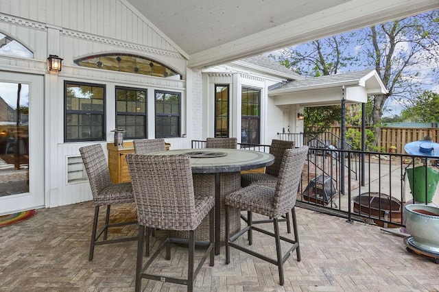 sunroom with french doors and lofted ceiling