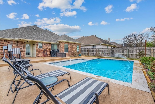 view of pool with a patio area, a fenced in pool, and a fenced backyard