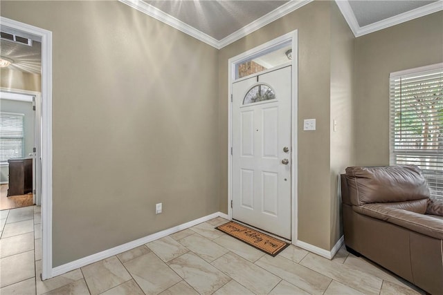 entrance foyer featuring crown molding, visible vents, and baseboards