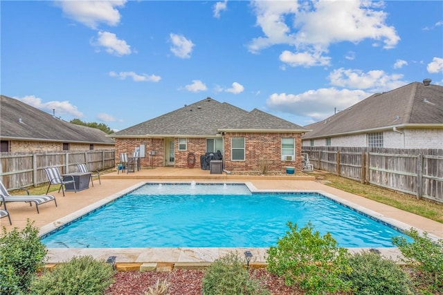 view of swimming pool featuring a fenced in pool, a fenced backyard, and a patio area