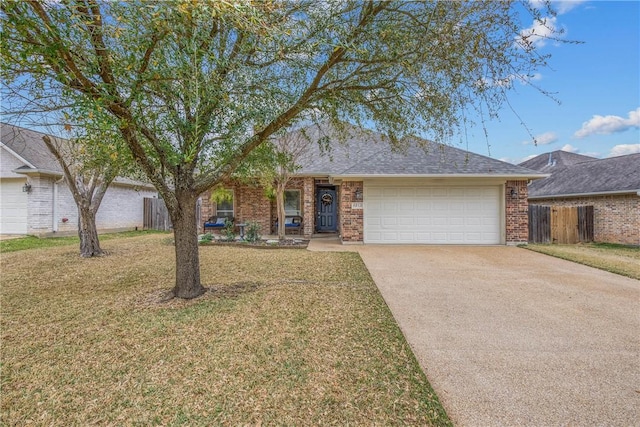 single story home with an attached garage, concrete driveway, a front lawn, and fence