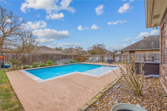 view of pool featuring a patio, a fenced backyard, and a fenced in pool