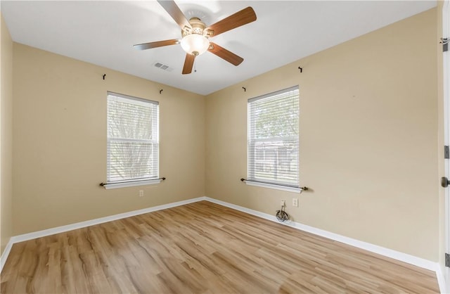 9939 County Road 272, Somerville, TX 77879 - empty room with light wood finished floors, ceiling fan, and baseboards