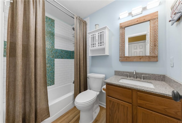 9939 County Road 272, Somerville, TX 77879 - full bathroom with toilet, shower / bath combination with curtain, vanity, and wood finished floors