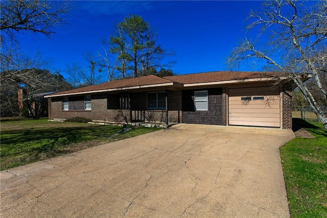 ranch-style home featuring a front yard and a garage