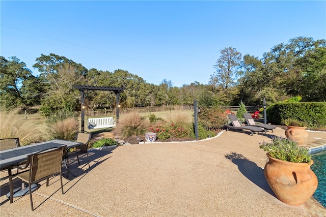 view of patio / terrace with outdoor dining area and fence