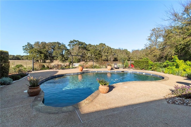 outdoor pool featuring a patio area