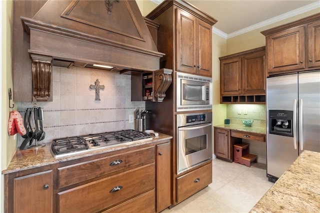 kitchen featuring light tile patterned floors, tasteful backsplash, custom range hood, appliances with stainless steel finishes, and ornamental molding