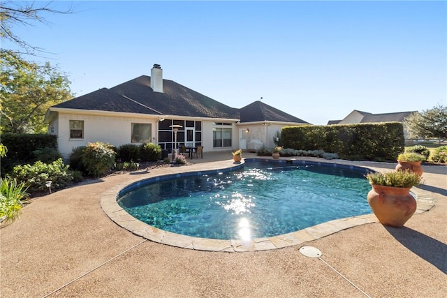 view of swimming pool featuring a patio area and a fenced in pool