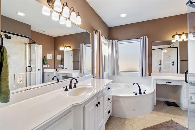 bathroom with a stall shower, tile patterned flooring, a garden tub, and vanity