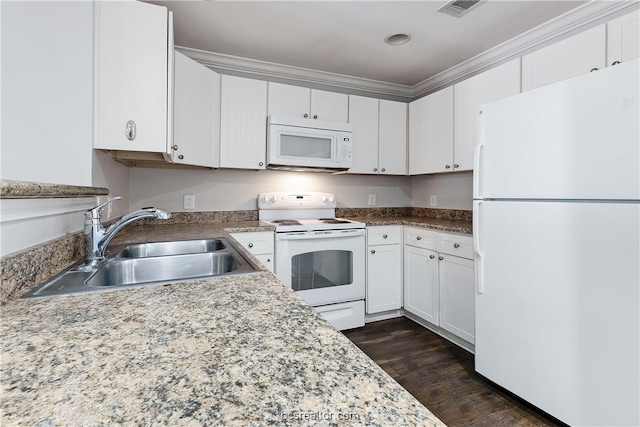 kitchen with white appliances, white cabinets, sink, ornamental molding, and dark hardwood / wood-style flooring