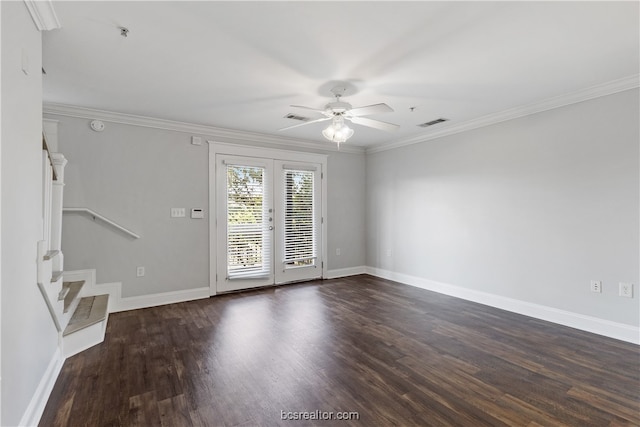 unfurnished room with ceiling fan, dark hardwood / wood-style flooring, ornamental molding, and french doors