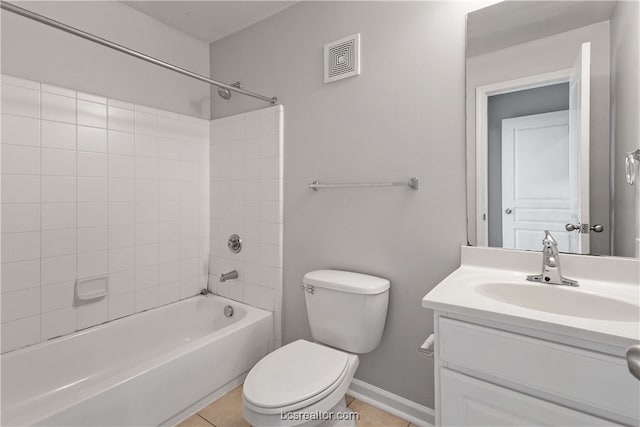 full bathroom featuring tile patterned floors, toilet, vanity, and tiled shower / bath