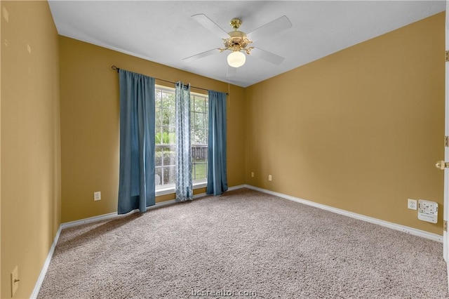 unfurnished room featuring carpet and ceiling fan