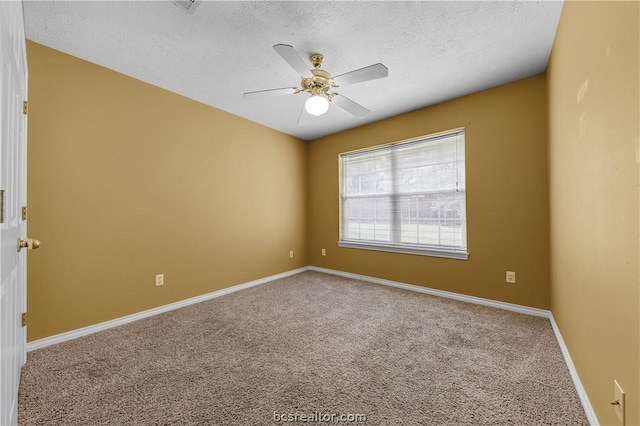 carpeted empty room featuring a textured ceiling and ceiling fan