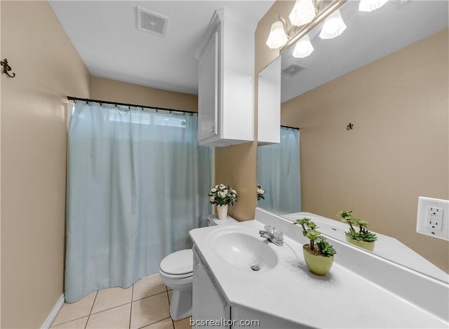 bathroom featuring tile patterned floors, vanity, and toilet