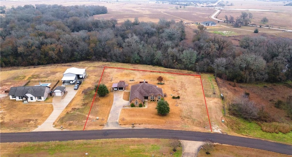 birds eye view of property featuring a rural view