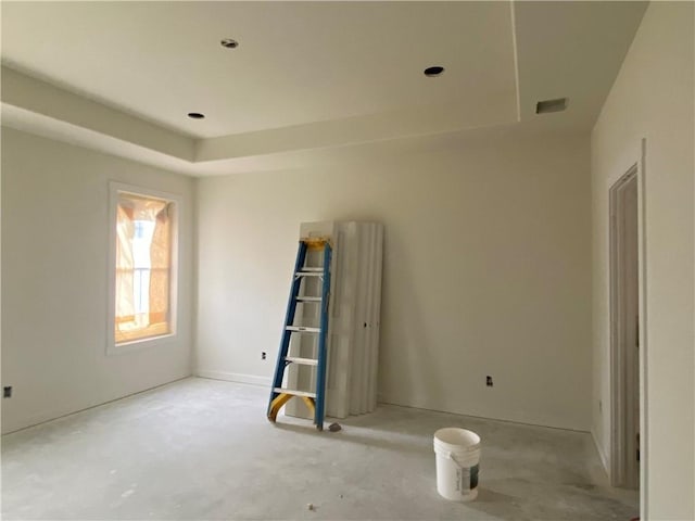 empty room with a tray ceiling