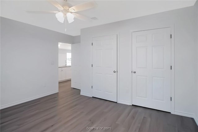 unfurnished bedroom featuring ceiling fan and hardwood / wood-style floors