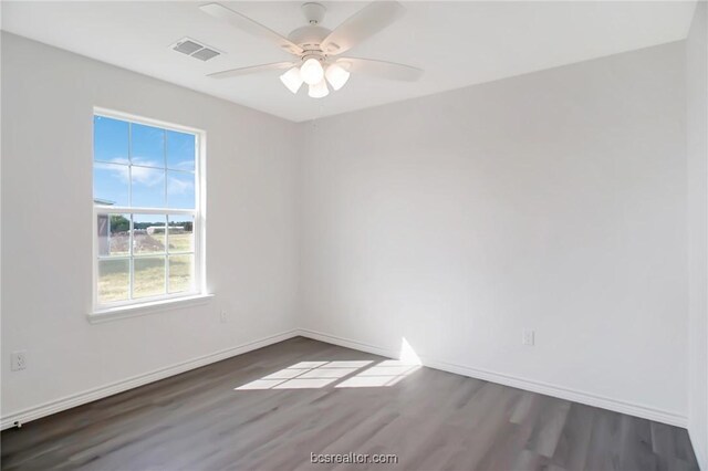 unfurnished room with ceiling fan and dark wood-type flooring