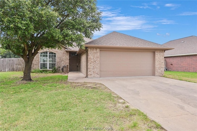 ranch-style home with a garage and a front yard