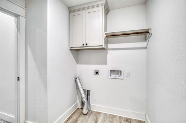 laundry room with baseboards, hookup for a washing machine, light wood-style floors, cabinet space, and electric dryer hookup