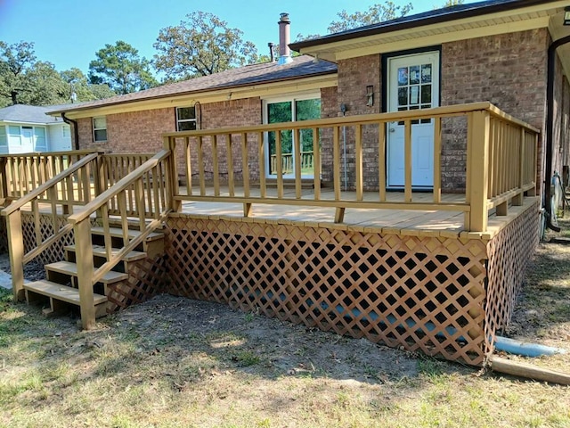 rear view of house featuring a deck