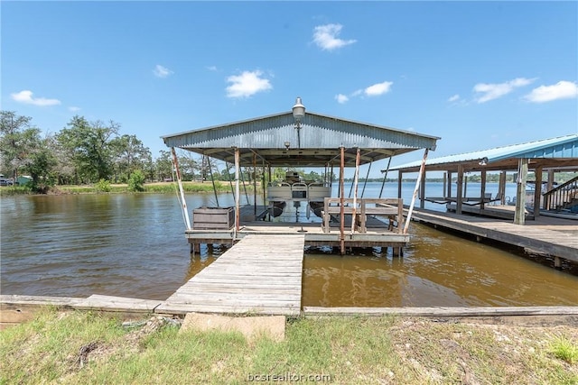 10933 Clyde Accord Rd, Franklin, TX 77856 - dock featuring boat lift and a water view
