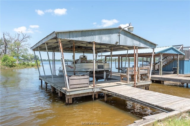 10933 Clyde Accord Rd, Franklin, TX 77856 - dock featuring boat lift, a water view, and stairway
