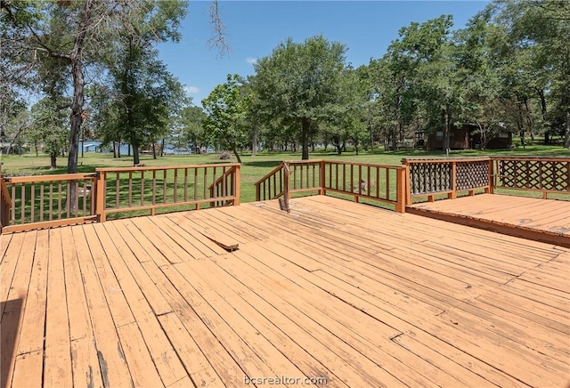 10933 Clyde Accord Rd, Franklin, TX 77856 - wooden deck featuring a lawn and view of scattered trees