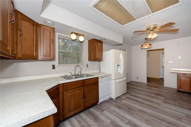 kitchen with ceiling fan, sink, white appliances, and light hardwood / wood-style flooring