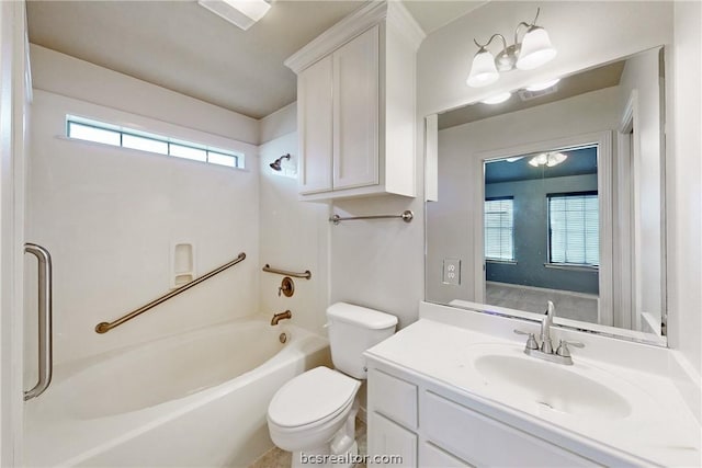 full bathroom with vanity, toilet, washtub / shower combination, and an inviting chandelier