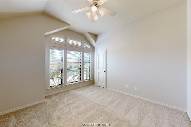 unfurnished room featuring light carpet, ceiling fan, and lofted ceiling