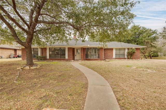 ranch-style home with a front yard