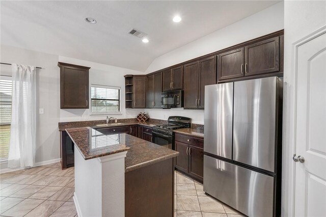 kitchen featuring sink, a center island, dark brown cabinets, dark stone countertops, and black appliances