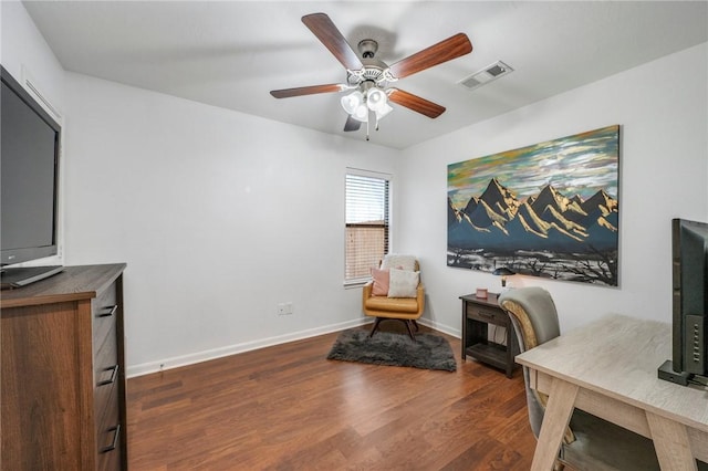 office area with dark wood-type flooring and ceiling fan