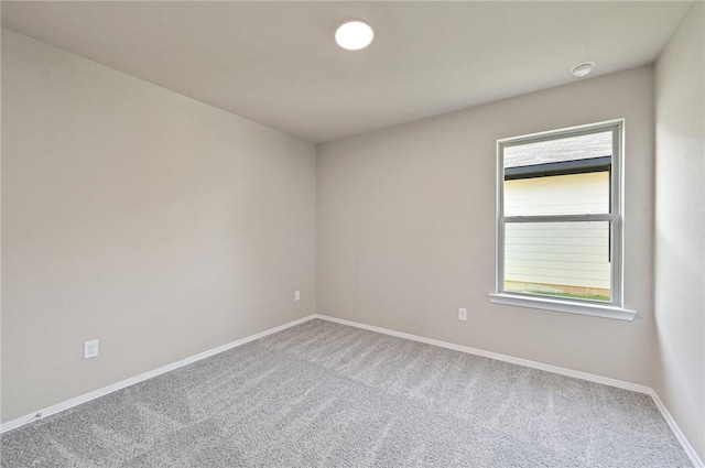 empty room featuring carpet and plenty of natural light