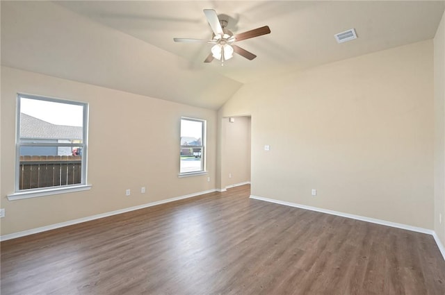 unfurnished room with dark hardwood / wood-style floors, ceiling fan, and lofted ceiling