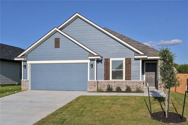 craftsman inspired home with a front lawn and a garage