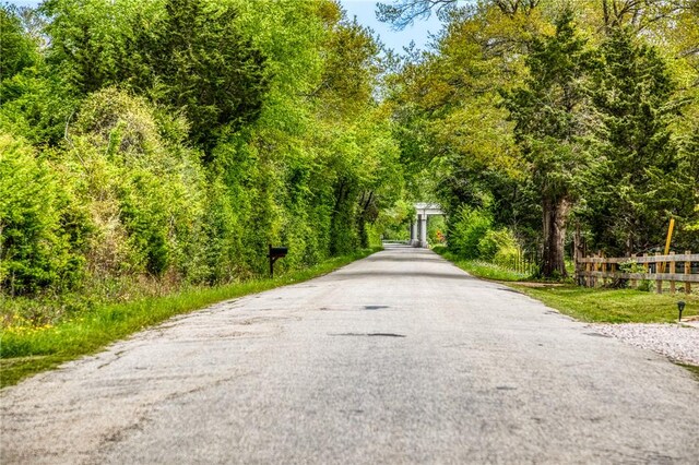 view of road with a forest view