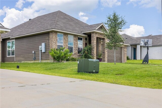 219 Cross Ln, Caldwell, TX 77836 - view of front facade with a front yard, a garage, and concrete driveway