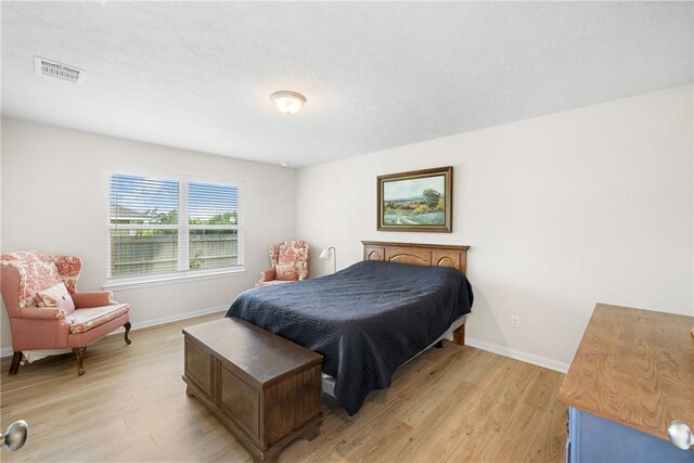 219 Cross Ln, Caldwell, TX 77836 - bedroom featuring light wood-style floors and baseboards