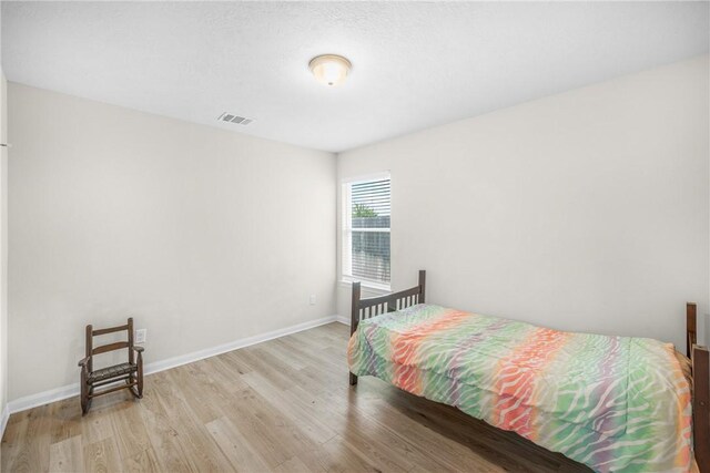 219 Cross Ln, Caldwell, TX 77836 - bedroom featuring light wood finished floors and baseboards