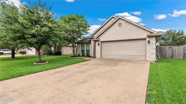 view of front of house featuring fence, an attached garage, a front lawn, brick siding, and concrete driveway