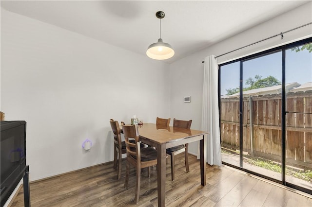4509 Carter Creek Pkwy Unit 7, Bryan, TX 77802 - dining area featuring wood finished floors