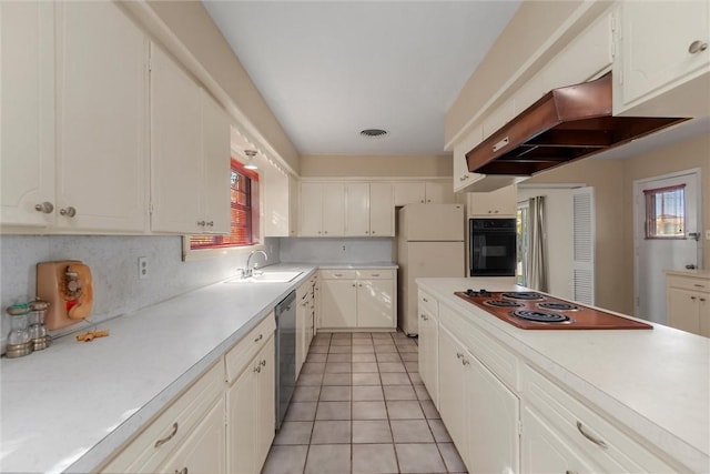 kitchen with black oven, white cabinetry, dishwasher, and white fridge