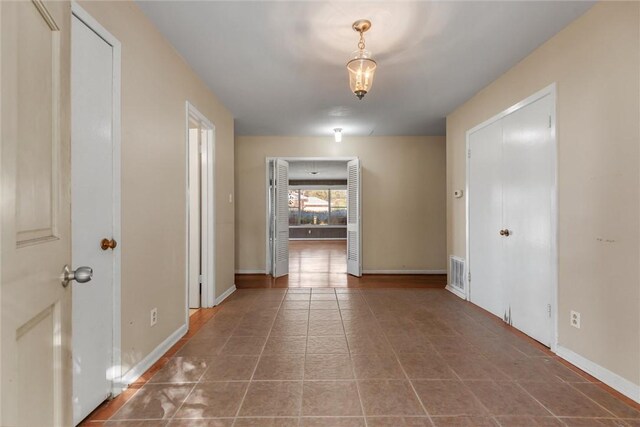 hall featuring tile patterned floors